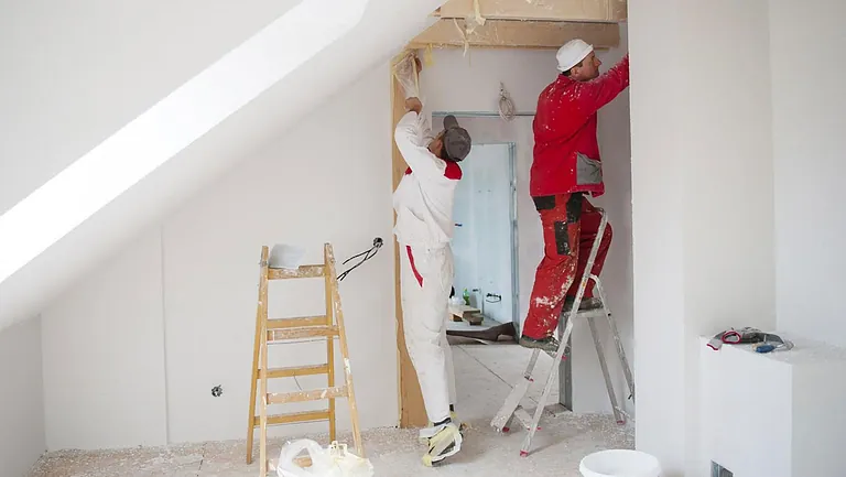 Decorators decorating a loft space